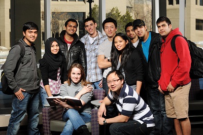 Diverse group of college students posing a for a photo